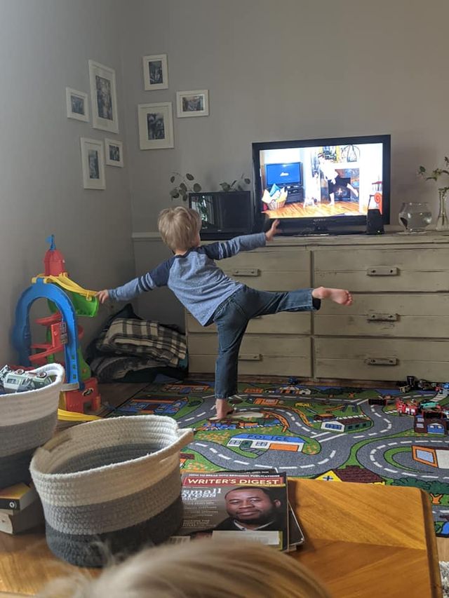 Little boy exercising at home with fit2b.com